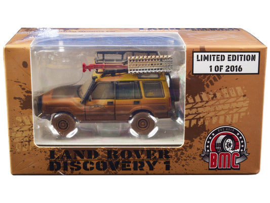Land Rover Discovery 1 RHD (Right Hand Drive) &quot;Camel Trophy&quot; Yellow (Dirty Mud Version) with Roof Rack Extra Wheels and Accessories Limited Edition to 2016 pieces Worldwide 1/64 Diecast Model Car by BM Creations